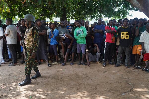 A soldier stands guard prior to the government officials visit following an attack by gunmen in Yelewata community north-central Nigeria, Monday, June 16, 2025. (AP Photo)