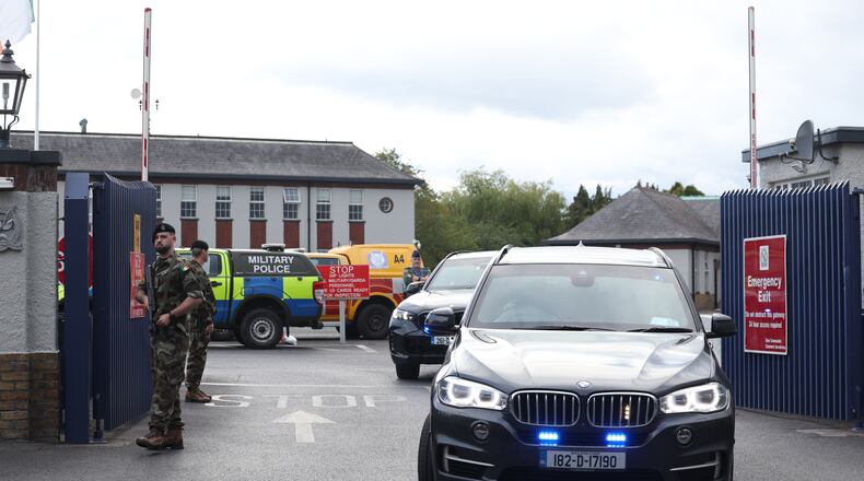 Garda vehicles leaving Casement Aerodrome, Baldonnell, Ireland, Sunday, Aug. 9, 2026, where a Irish government plane believed to be carrying Daniel Kinahan landed, following him being extradited from Dubai, to face a charge of directing an organized crime group. (Damien Eagers/PA via AP)
