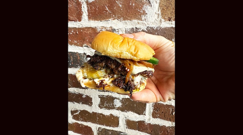 The Westside, with caramelized onion, jalapenos, garlic aioli, pickles and white American cheese is on the menu at Smash, Burgers by Vice, opening soon in Milton. (Courtesy of Nick Leahy)