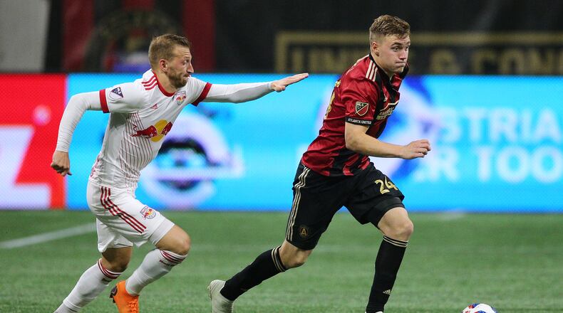 Atlanta United midfielder Julian Gressel gets past a New York Red Bulls defender during the second half in a MLS soccer match on Sunday, May 20, 2018, in Atlanta.   Curtis Compton/ccompton@ajc.com