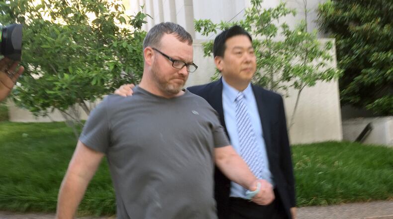 Bryan Moles, left, with attorney Eugene Ohm in Washington on June 1. (AP Photo/Jessica Gresko, File)