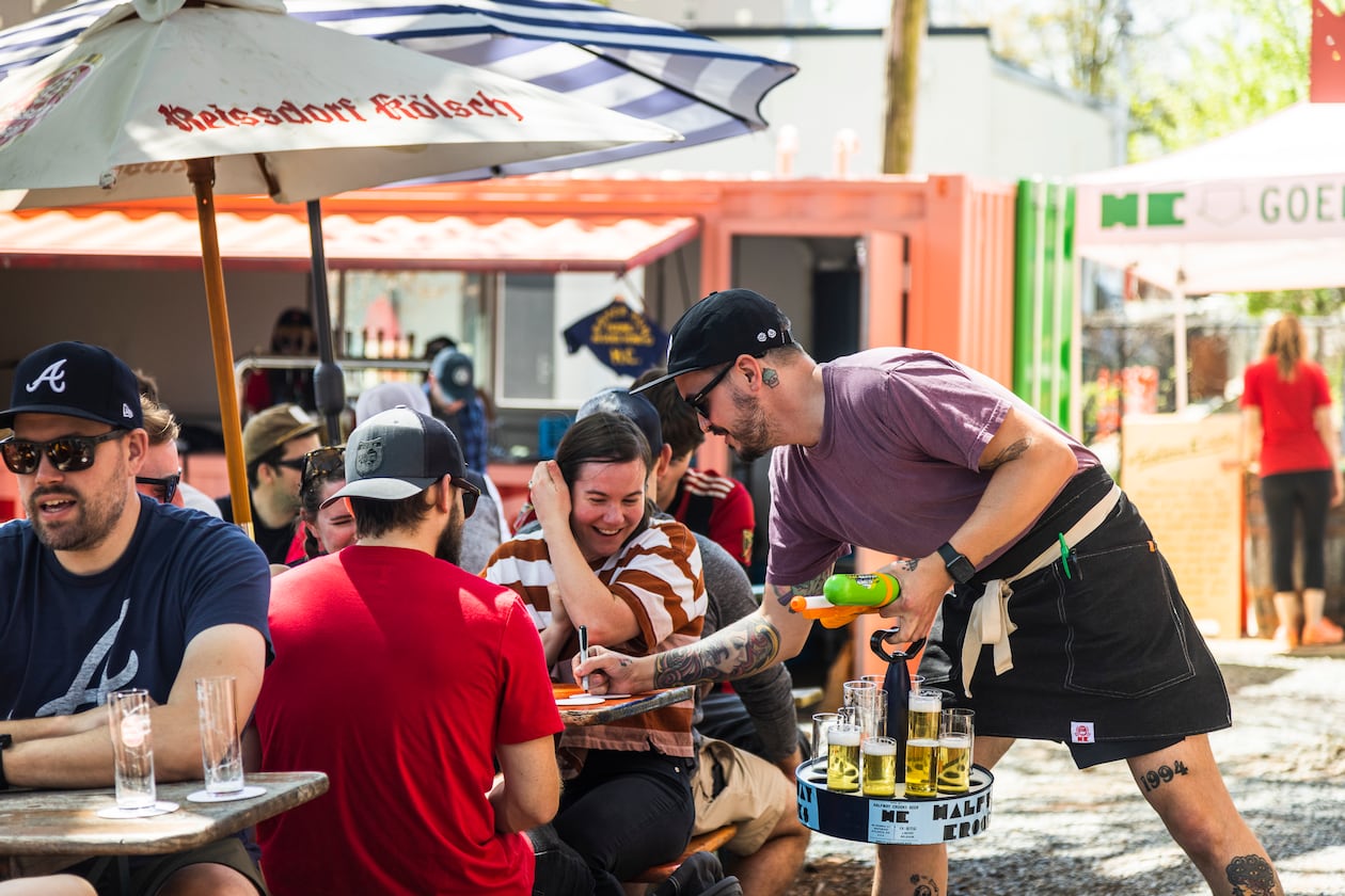 A server brings Kolsch, a German beer, around to customers at Halfway Crooks' annual Kolsch Fest. (Courtesy of Halfway Crooks)