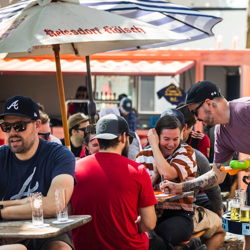 A server brings Kolsch, a German beer, around to customers at Halfway Crooks' annual Kolsch Fest. (Courtesy of Halfway Crooks)