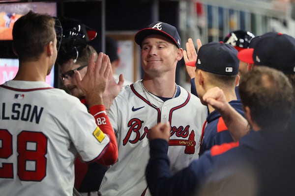 Braves starter AJ Smith-Shawver enjoys dugout congratulations after his eight-inning, one-hit outing. 