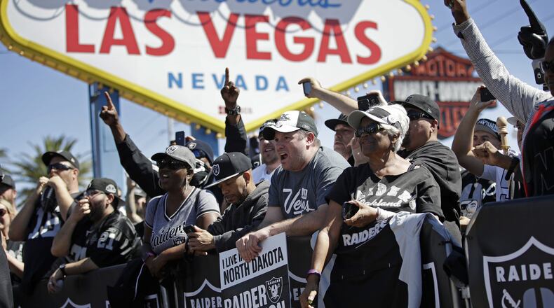 Fans cheer in 2017 as the Oakland Raiders announce their fourth-round draft pick during an NFL draft event in Las Vegas. The NFL for a long time so worried about being associated with gambling or sports betting that players were forbidden to go into casinos, and Las Vegas overall was suspect. (AP Photo/John Locher, File)
