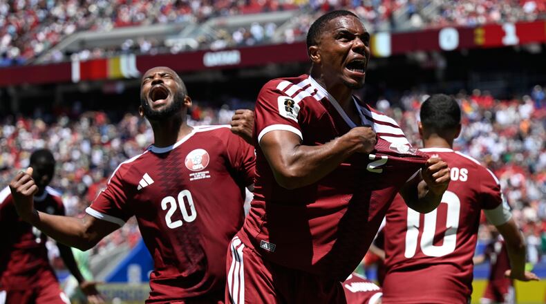Qatar's Pedro Miguel, yells as he celebrates after teammate Qatar's Boualem Khoukhi, scored his sides first goal during the World Cup Group B soccer match between Qatar and Switzerland in Santa Clara, Calif., near San Francisco, Saturday, June 13, 2026. (AP Photo/Eakin Howard)