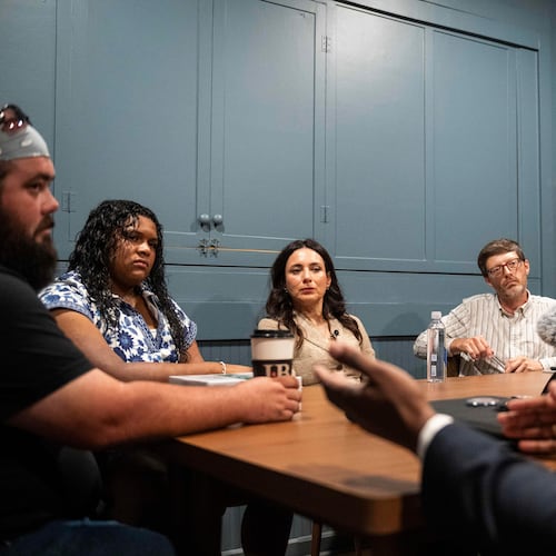 Democratic candidate for Texas governor Gina Hinojosa, third from the left, listens to Stephen Sanders, right, during a roundtable discussion on data centers, Saturday, July 18, 2026, in Lubbock, Texas. (AP Photo/Justin Rex)