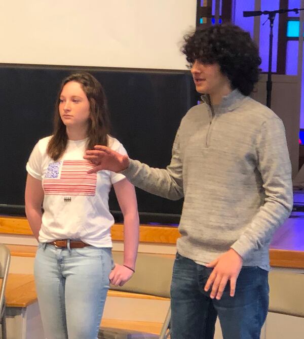 Izzy Wiltse, left and Royce Mann talk to members of March for Our Lives Georgia who gathered Sunday, March 24 on the anniversary of their march in downtown Atlanta to keep the momentum for gun control legislation going. ARLINDA SMITH BROADY/THE AJC