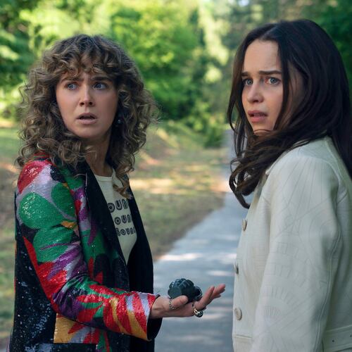 This image released by Peacock shows Haley Lu Richardson, left, and Emilia Clarke in a scene from "Ponies." (Katalin Vermes/Peacock via AP)