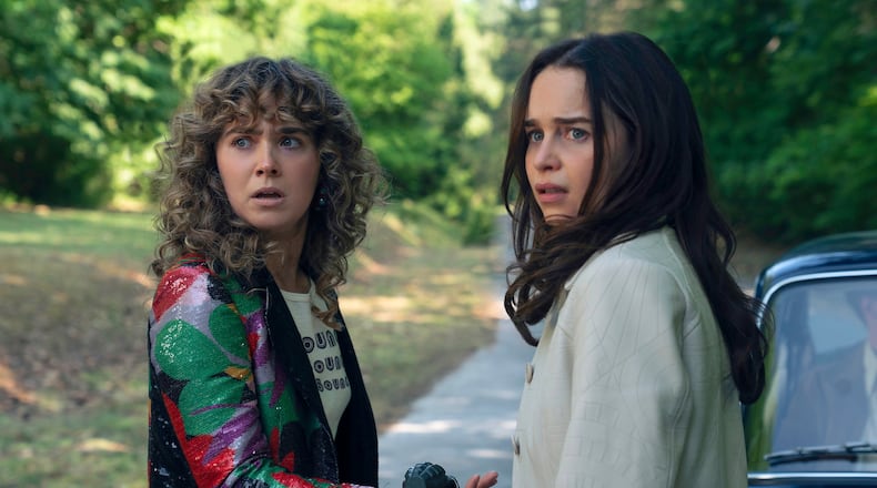 This image released by Peacock shows Haley Lu Richardson, left, and Emilia Clarke in a scene from "Ponies." (Katalin Vermes/Peacock via AP)