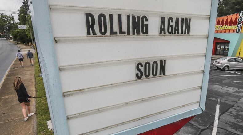 A sign at an Atlanta business on Thursday, April 23, 2020. JOHN SPINK/JSPINK@AJC.COM