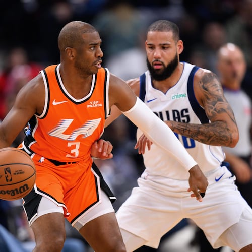 Los Angeles Clippers guard Chris Paul (3) controls the ball under pressure from Dallas Mavericks forward Caleb Martin during the first half of an NBA basketball game Saturday, Nov. 29, 2025, in Inglewood, Calif. (AP Photo/William Liang)