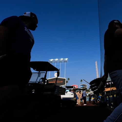 Toronto Blue Jays players work out ahead of Game 3 of the 2025 World Series against the Los Angeles Dodgers in Los Angeles, Sunday, Oct. 26, 2025. (AP Photo/Ashley Landis)