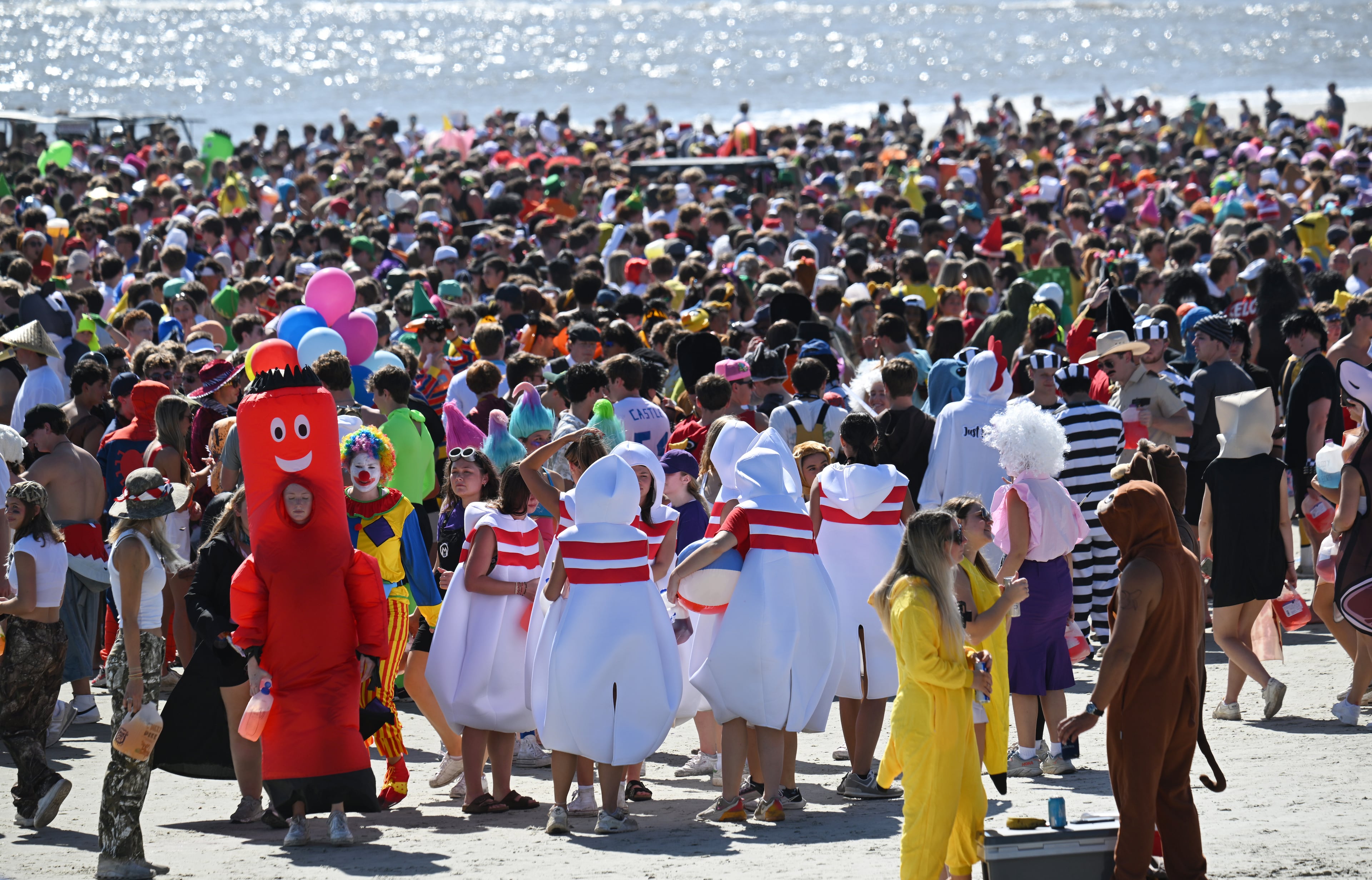 Thousands of UGA students gather during the annual “Frat Beach” party for the weekend of the Georgia-Florida football game on St. Simons Island, Friday, November 1, 2024. On the weekend of the Georgia-Florida football game, St. Simons Island’s East Beach becomes “Frat Beach,” an open-air party teeming with thousands of college students. (Hyosub Shin / AJC)