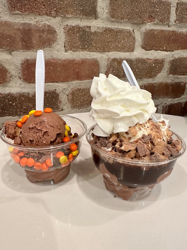 Two chocolate sundaes in plastic cups from Southern Custard.