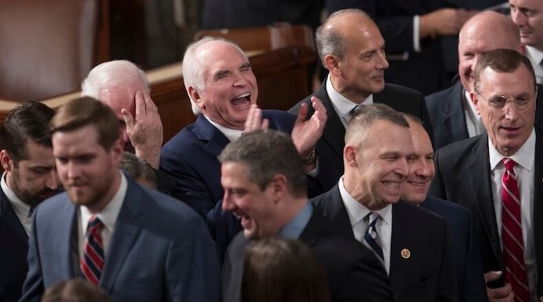 Republican members of the House of Representatives gather in the chamber as the 115th Congress convenes at the Capitol in Washington, Tuesday, Jan. 3, 2017. Rep. Mike Kelly, R-Pa., laughs at center top. With the GOP now in control of the White House, the Senate, and the House, Republicans are expected to begin dismantling eight years of President Barack Obama's Democratic policies, including his signature health care law. (AP Photo/J. Scott Applewhite)