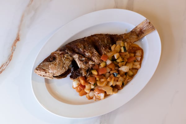 Whole snapper at Le Nouveau Maquis on Saturday, June 6, 2026 in Tucker, Ga. (Frankie Cole for the AJC)