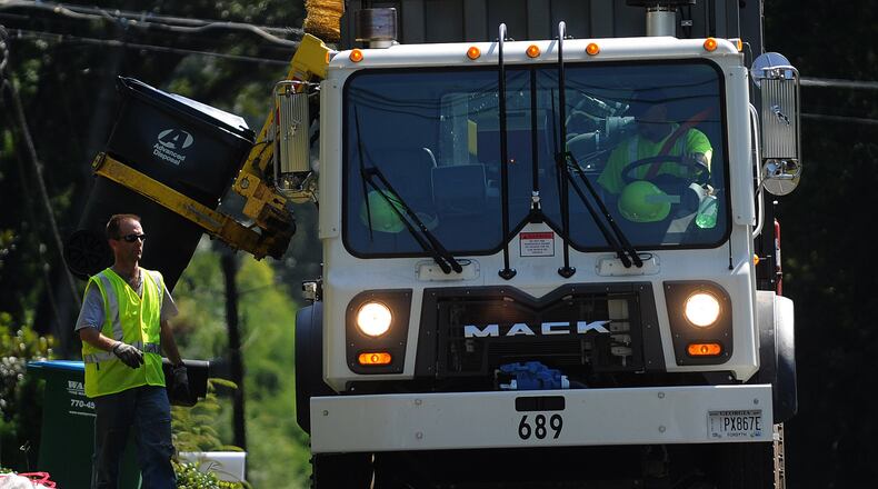Residents of unincorporated Gwinnett will see an increase of about $16 in trash fees compared to last year for fuel and inflation costs, even after a $6 credit for service issues. AJC file photo