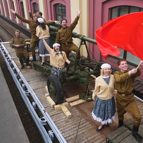 Actors attend a historical reenactment depicting the arrival of trains after the end of the war as a part of celebrations ahead of the 81st anniversary of the Soviet Union's victory over Nazi Germany during World War II, at the Baltiysky railway station in St. Petersburg, Russia, Thursday, May 7, 2026. (AP Photo/Dmitri Lovetsky)
