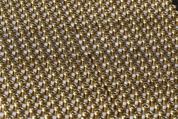 Dozens of handgun bullets are ready to load during a training session practicing a new technique to shoot and not kill. (Curtis Compton / Curtis.Compton@ajc.com)