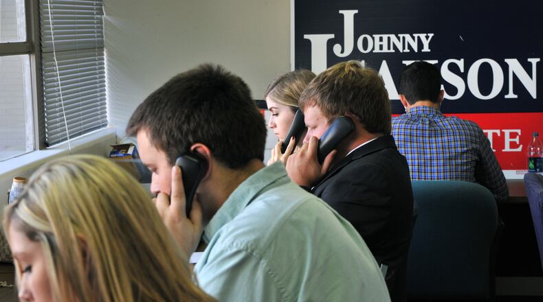 Volunteers make phone calls to reach out to voters at Georgia Republican Party headquarters in Atlanta, September 2014. (AJC Photo / Hyosub Shin)