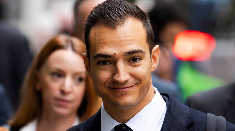 Spanish racing driver Alex Palou, arrives at the Rolls Building of the Royal Courts of Justice to give evidence in McLaren's legal claim against him, in central London, Friday, Oct. 10, 2025. (Jordan Pettitt/PA via AP)