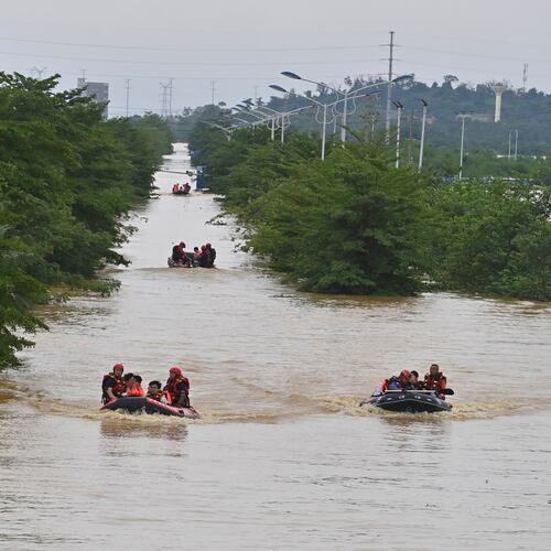 In this photo released by Xinhua News Agency, rescuers evacuate stranded teachers and students at Xijiang education park in the aftermath of tropical storm Maysak in Guigang City, south China's Guangxi Zhuang Autonomous Region, July 8, 2026. (Zhou Hua/Xinhua via AP)