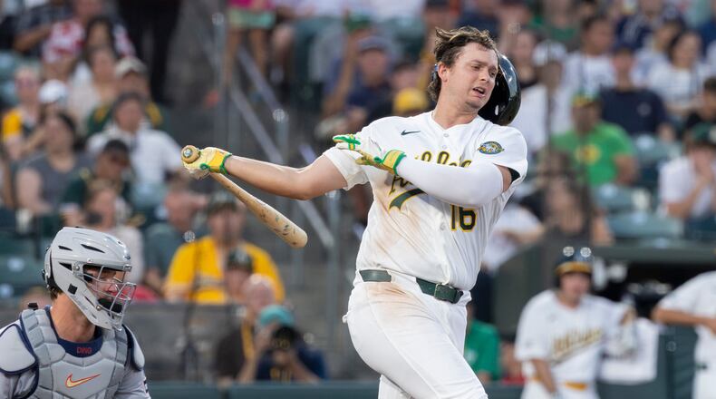 Athletics' Nick Kurtz loses his batting helmet on a swing during the fifth inning of a baseball game against the Detroit Tigers, Friday, July 31, 2026, in West Sacramento, Calif. (AP Photo/Sara Nevis)
