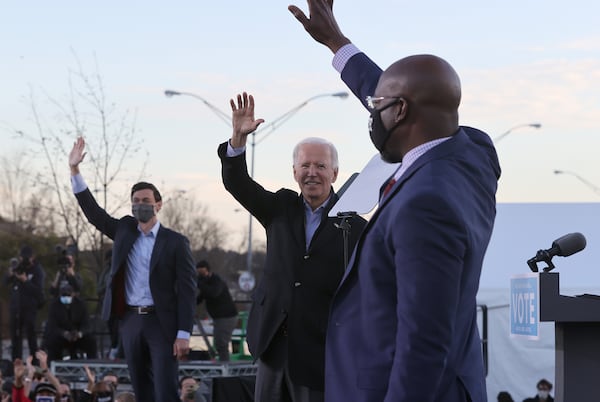 Democrats are coming off big wins in Georgia during the 2020 election cycle, including the victory by Joe Biden, center, in the state's presidential election, and a sweep by Jon Ossoff, left, and Raphael Warnock in the U.S. Senate runoffs. But Democrats now face a different and difficult climate, with Biden's approval rating currently underwater. (Chip Somodevilla/Getty Images/TNS)