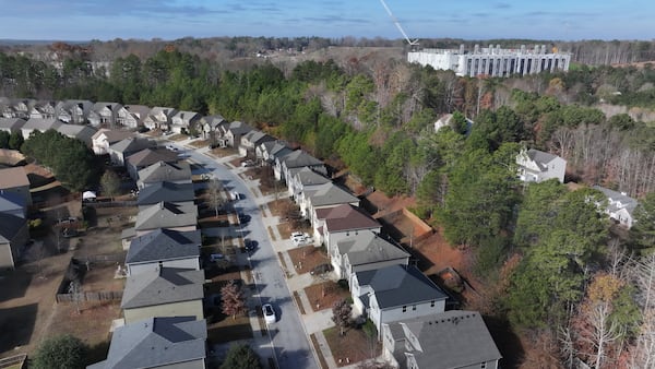 An aerial image shows the Microsoft data center in the background near residential areas in Union City on Wednesday, Dec. 3, 2025. The project, developed by EdgeConnex on 136 acres of land, costs almost $2 billion and is currently under construction. (Miguel Martinez/AJC)