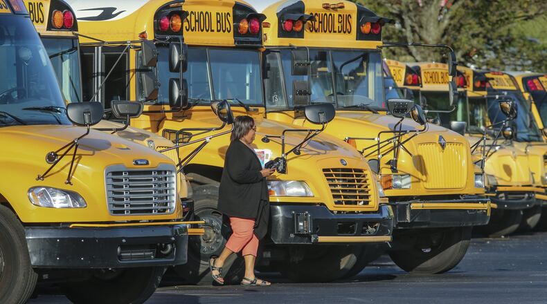 Several buses remained in the parking lot during morning pickup times at the DeKalb County School District’s Offices at 1701 Mountain Industrial Boulevard in Stone Mountain on Thursday morning April 19, 2018. Nearly 400 drivers staged a sickout protest over pay, retirement benefits and divers’ overall treatment. School Superintendent Steve Green said every driver who missed work would have to show a doctor’s note. Students were not counted as tardy if their buses arrived late, and the district rescheduled Georgia Milestones testing. JOHN SPINK/JSPINK@AJC.COM