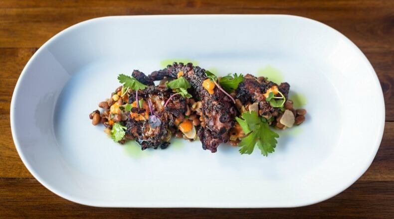 Grilled Spanish octopus, Sea Island red peas, mint oil, chili-garlic purée, cilantro, $14 gf at 1KEPT