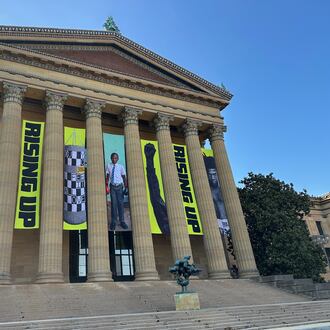 Banners for the "Rising Up: Rocky" exhibition hang outside of the Philadelphia Museum of Art in Philadelphia, Wednesday, April 22, 2026. (AP Photo/Tassanee Vejpongsa)