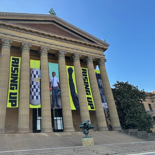 Banners for the "Rising Up: Rocky" exhibition hang outside of the Philadelphia Museum of Art in Philadelphia, Wednesday, April 22, 2026. (AP Photo/Tassanee Vejpongsa)