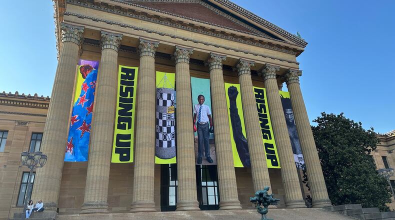 Banners for the "Rising Up: Rocky" exhibition hang outside of the Philadelphia Museum of Art in Philadelphia, Wednesday, April 22, 2026. (AP Photo/Tassanee Vejpongsa)
