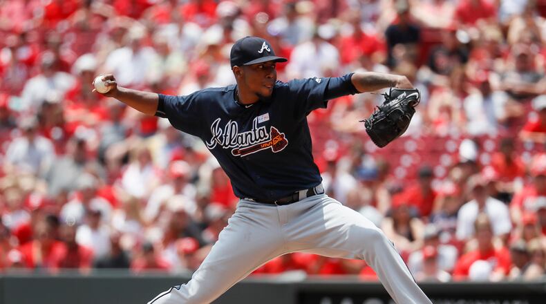 Atlanta Braves starting pitcher Julio Teheran throws in the first inning of a baseball game against the Cincinnati Reds, Sunday, June 4, 2017, in Cincinnati. (AP Photo/John Minchillo)