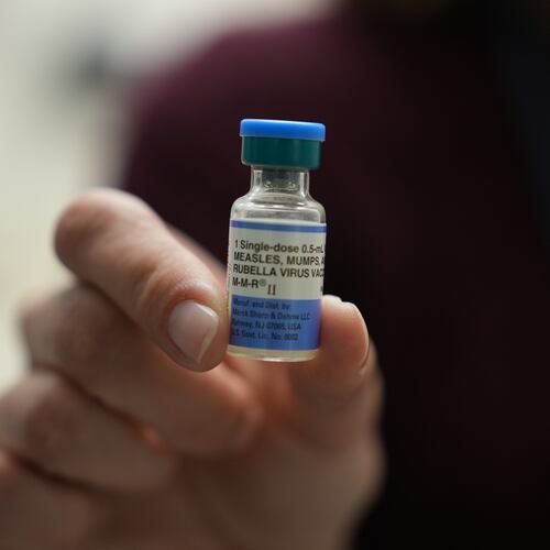 FILE - Dr. Jessica Early holds a vial of the combination measles, mumps and rubella vaccine at Prisma Health Pediatrics in Greer, S.C., March 18, 2026. (AP Photo/Mary Conlon, File)