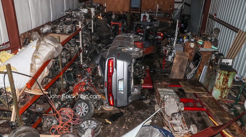A car ran off Moreland Avenue, flipped and crashed into an auto repair shop Sunday night. The shop's owners said a stretch of Moreland Avenue near Key Road is notorious for street racing.