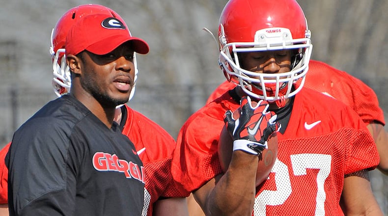 Thomas Brown (left), a former Bulldogs running back himself, coached Nick Chubb (right) and the tailbacks at Georgia this season.
