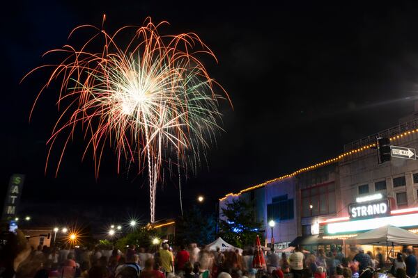 Spectators watch fireworks next to Glover Park in Marietta, on July 4, 2022, as part of the city’s 4th In the Park celebration. (Chris Day/AJC)