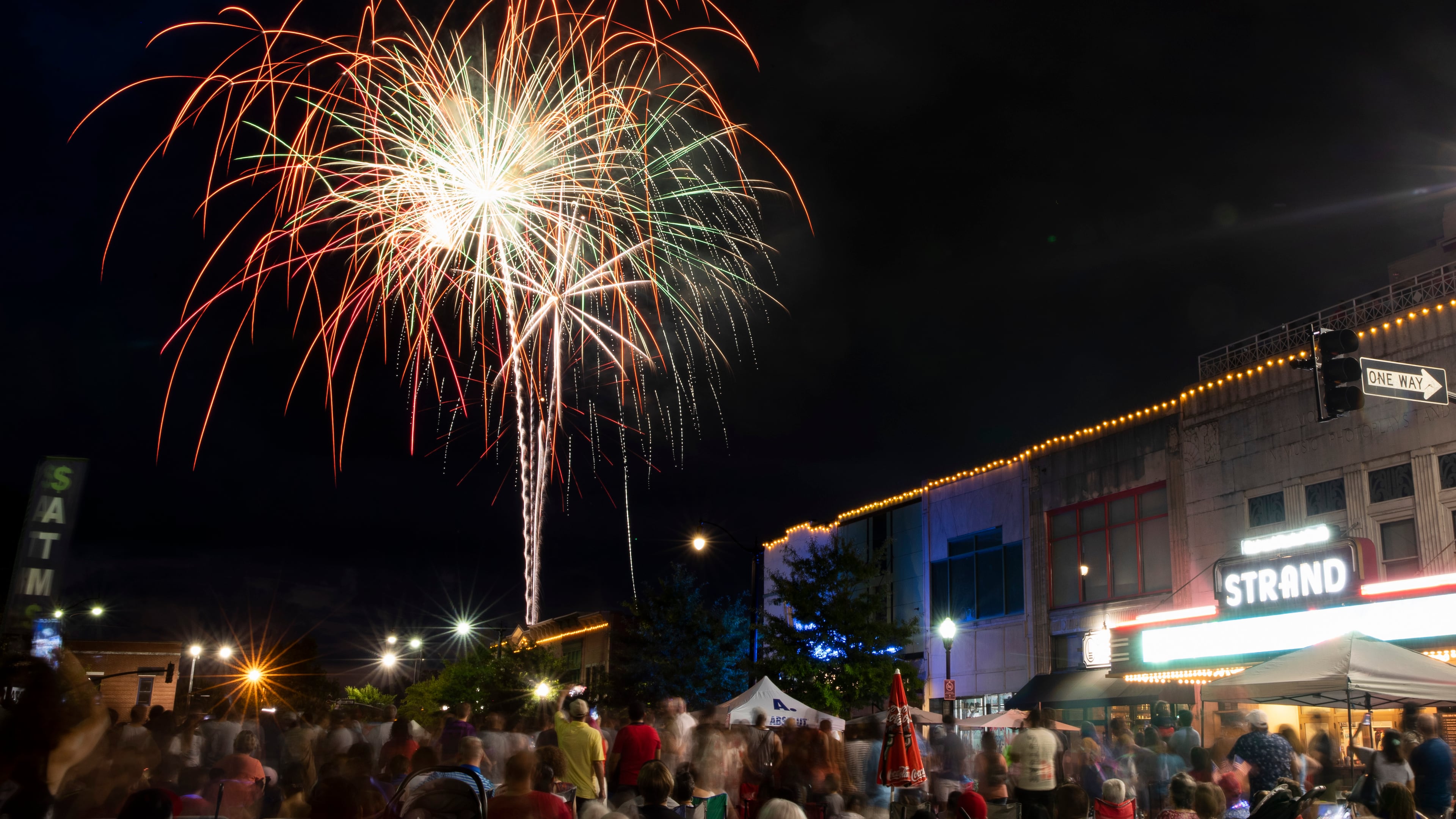 Spectators watch fireworks next to Glover Park in Marietta as part of the city’s Fourth of July celebration. Experts say it's best to leave shooting fireworks to the professionals. (Chris Day/AJC 2022)