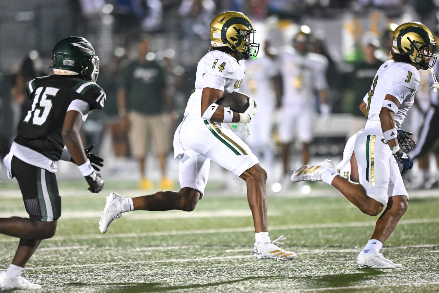 Grayson’s London Goggans carries the ball for a gain in yardage against Collins Hill during the second half of play Friday, August 15, 2025. (Daniel Varnado for the AJC)