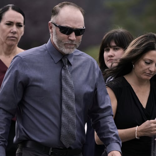 Tyler Robinson’s parents, Matt Robinson and Amber Robinson, right, arrive at the Fourth District Courthouse, Tuesday, July 7, 2026, in Provo, Utah, ahead of a hearing for Tyler Robinson, who is accused in the fatal shooting of Charlie Kirk. (AP Photo/Spenser Heaps)