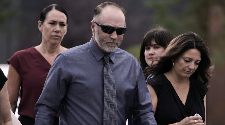 Tyler Robinson’s parents, Matt Robinson and Amber Robinson, right, arrive at the Fourth District Courthouse, Tuesday, July 7, 2026, in Provo, Utah, ahead of a hearing for Tyler Robinson, who is accused in the fatal shooting of Charlie Kirk. (AP Photo/Spenser Heaps)