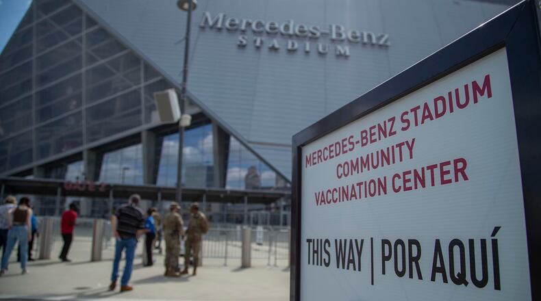 People flocked to mass vaccination sites like this one at Mercedes Benz stadium in downtown Atlanta. Most of the eager people are vaccinated now, and this one and others are getting ready to shut down. (Alyssa Pointer / Alyssa.Pointer@ajc.com)