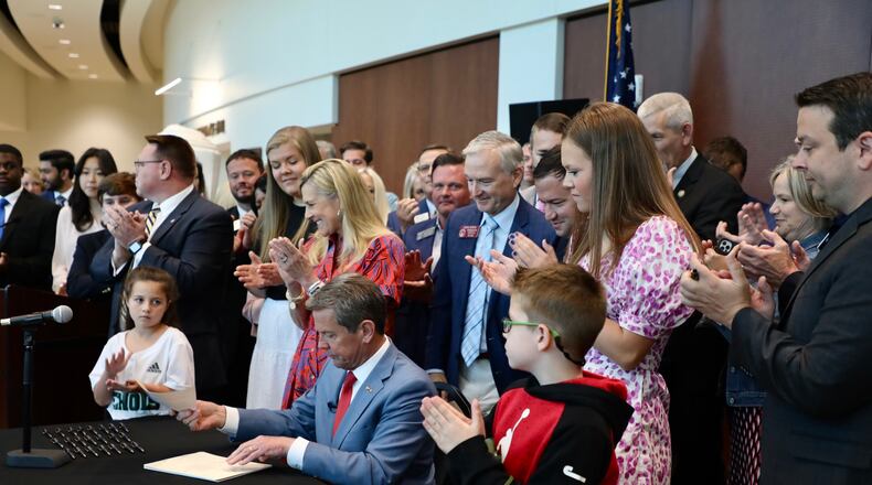 Gov. Brian Kemp signs education-related legislation in Forsyth County on April 28, 2022. Special.