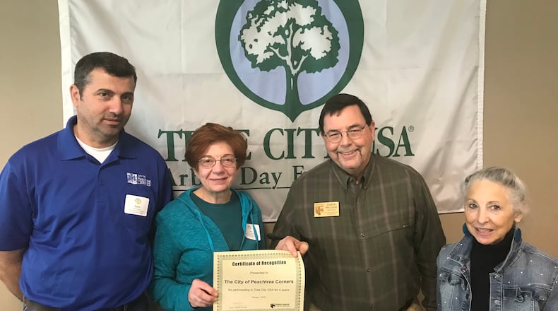 Peachtree Corners Land Development Inspector Salim Maalouf, resident Lorrie Backer, Georgia Forestry Commission Director Chuck Williams and resident and Master Gardener Hilary Wilson receive the city’s ‘Tree City USA’ honors. (Courtesy City of Peachtree Corners)