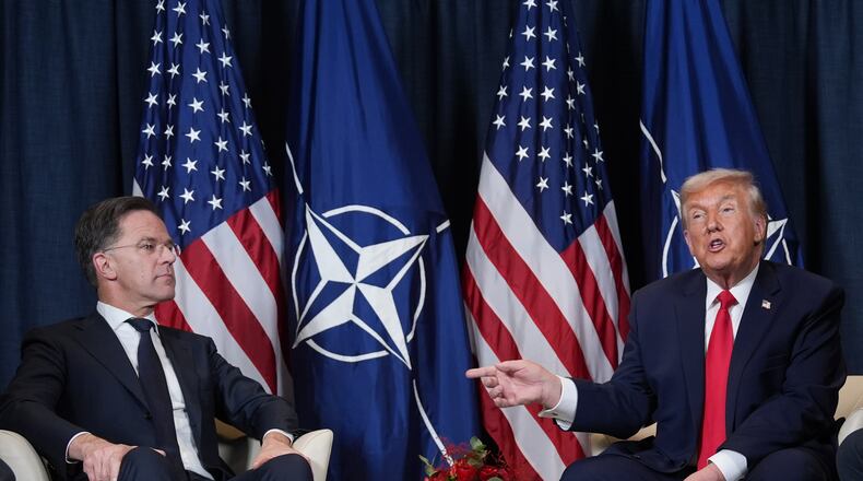 FILE - President Donald Trump, right, meets with NATO Secretary General Mark Rutte on the sidelines of the Annual Meeting of the World Economic Forum in Davos, Switzerland, Jan. 21, 2026. (AP Photo/Evan Vucci, File)