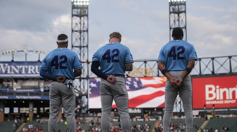 The Tampa Bay Rays stands for the Star-Spangled Banner on Jackie Robinson Day before a baseball game against the Tampa Bay Rays, Wednesday, April 15, 2026, in Chicago. (AP Photo/Erin Hooley)