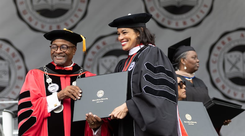 Clark Atlanta University President George T. French Jr. poses for photographs with the graduates after they received their diplomas at the commencement ceremony in Panther Stadium on Saturday, May 20, 2023. (Steve Schaefer / steve.schaefer@ajc.com)